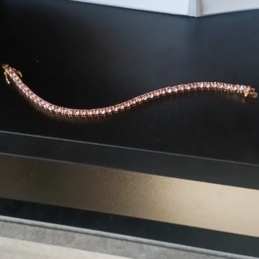 Elegant Gold Tone Bracelet with Pink Stones